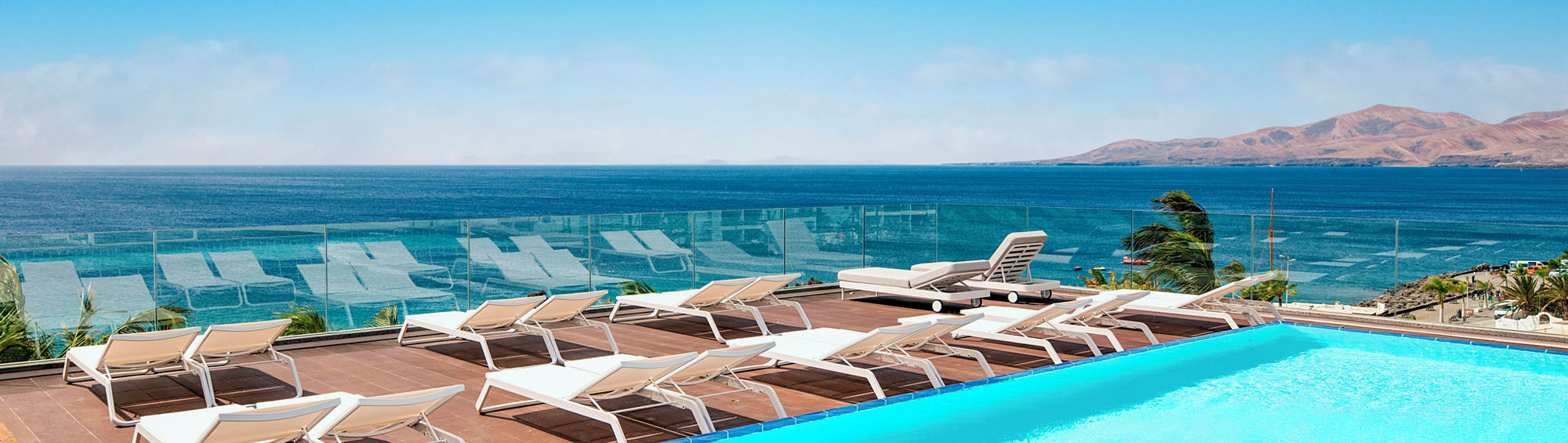 Image of deckchairs overlooking the sea at Hotel Fariones, Puerto Del Carmen, Lanzarote.